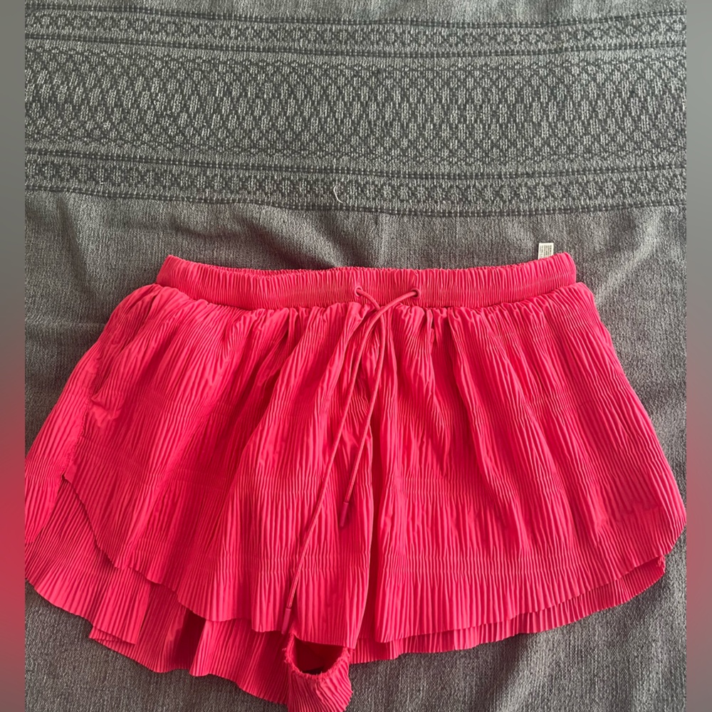 Large free people movement pink shirts textured.